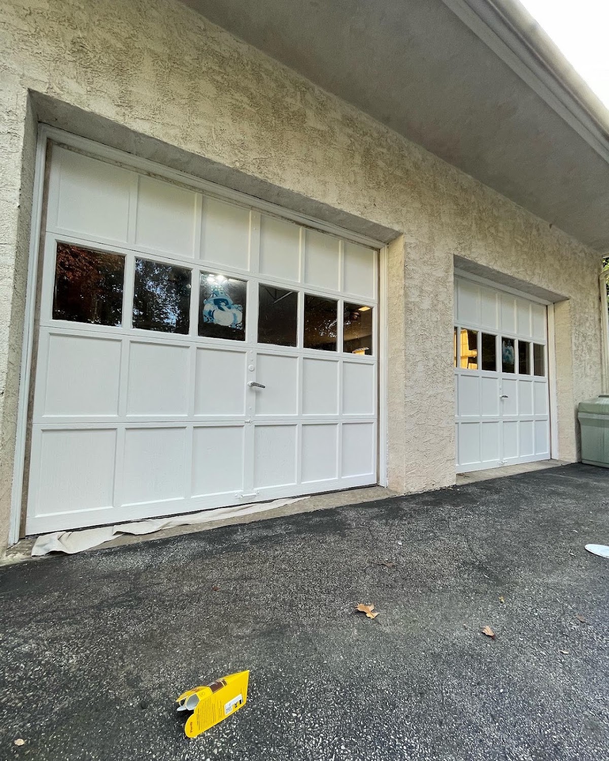 Freshly painted white carriage style garage doors in Pottstown PA