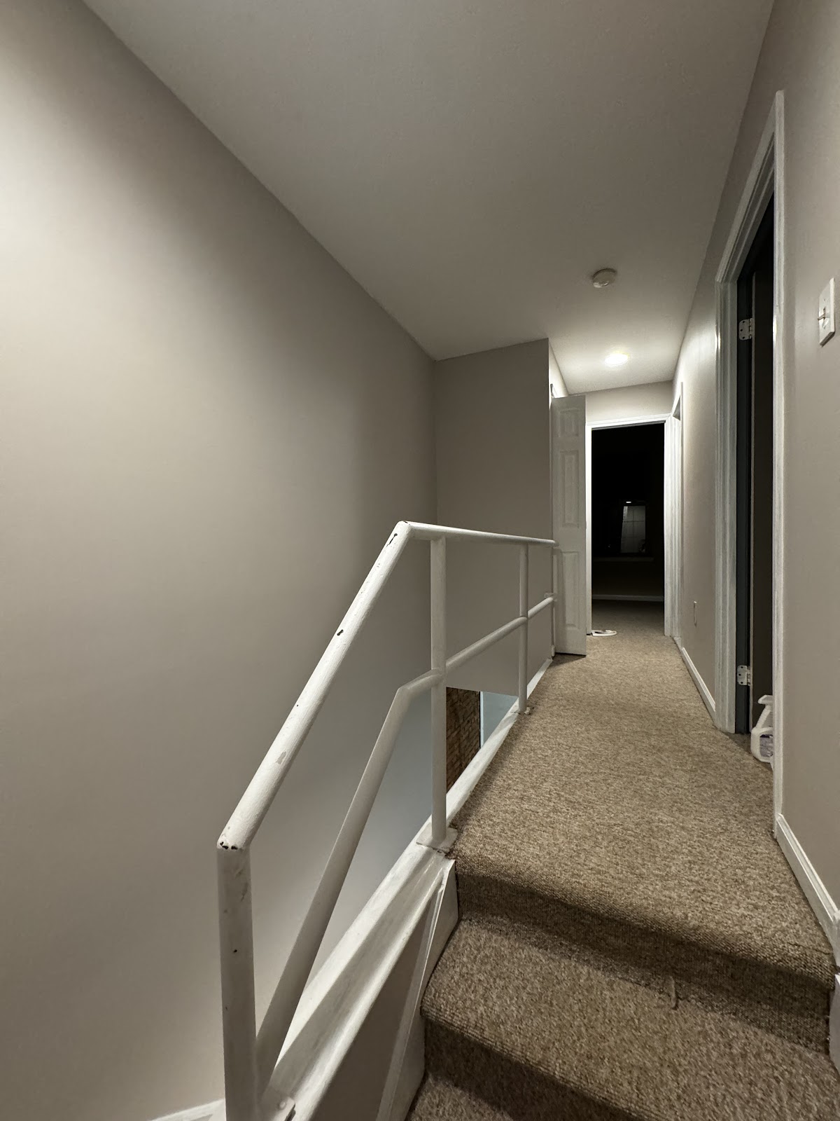 Freshly painted hallway and stairwell in warm greige